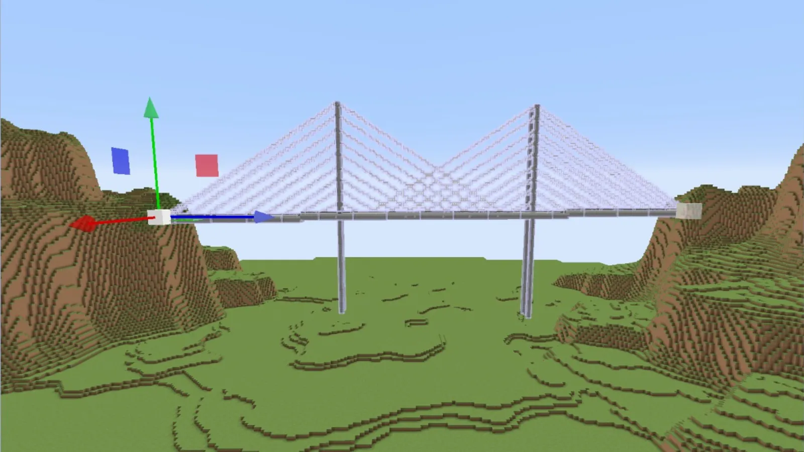 Eine mit EthicTools in Axiom gebaute Brücke über ein Tal in Minecraft